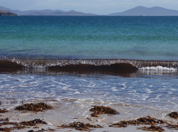 Waves breaking on a Harris beach - Photo by Nita